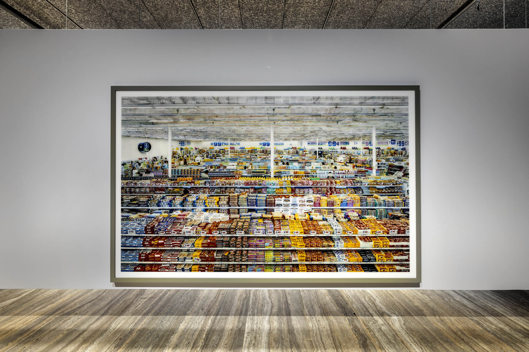 Installation view of the exhibition 'Typologien: Photography in 20th-century Germany' at Fondazione Prada, Milan showing Andreas Gursky's '99 Cent' 1999 Installation view of the exhibition 'Typologien: Photography in 20th-century Germany' at Fondazione Prada, Milan showing Andreas Gursky's '99 Cent' 1999