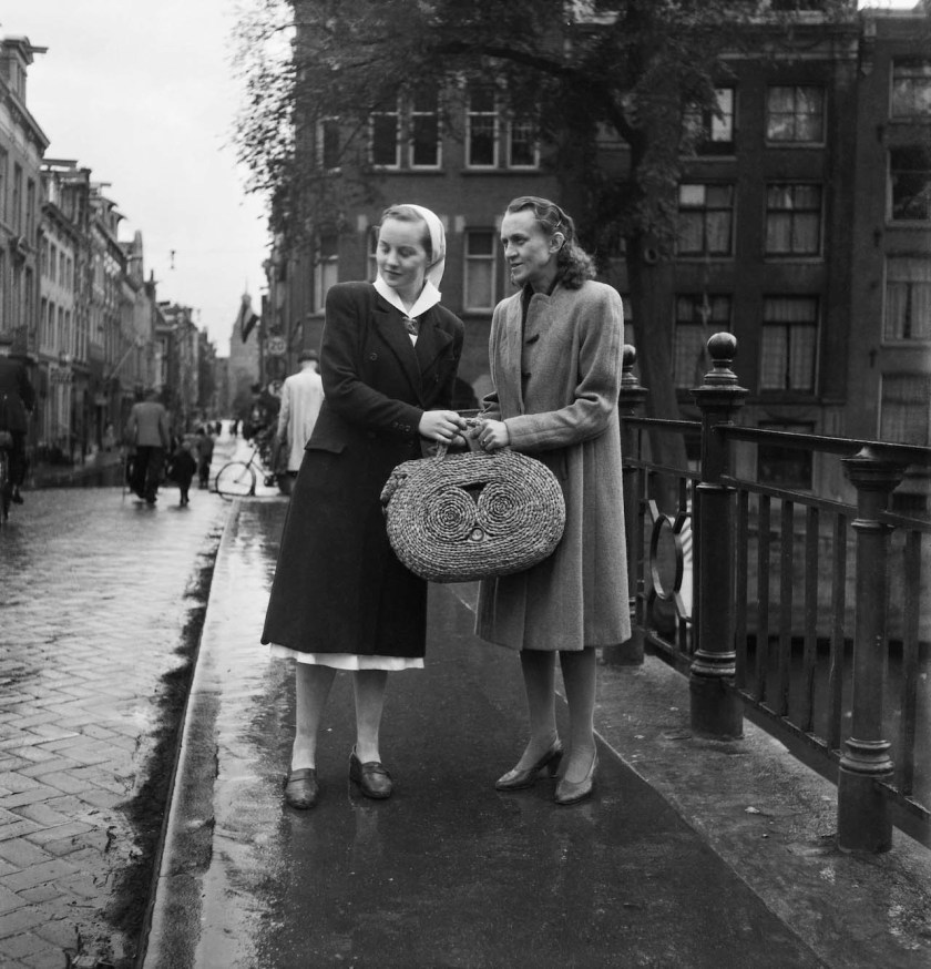 Charles Breijer (Dutch, 1914-2011) 'Margreet Meijboom-van Konijnenbrug (right) demonstrates photographing from a shopping bag. Andrea Domburg, in a nurse's uniform, accompanies her to keep an eye on the surroundings' Nd