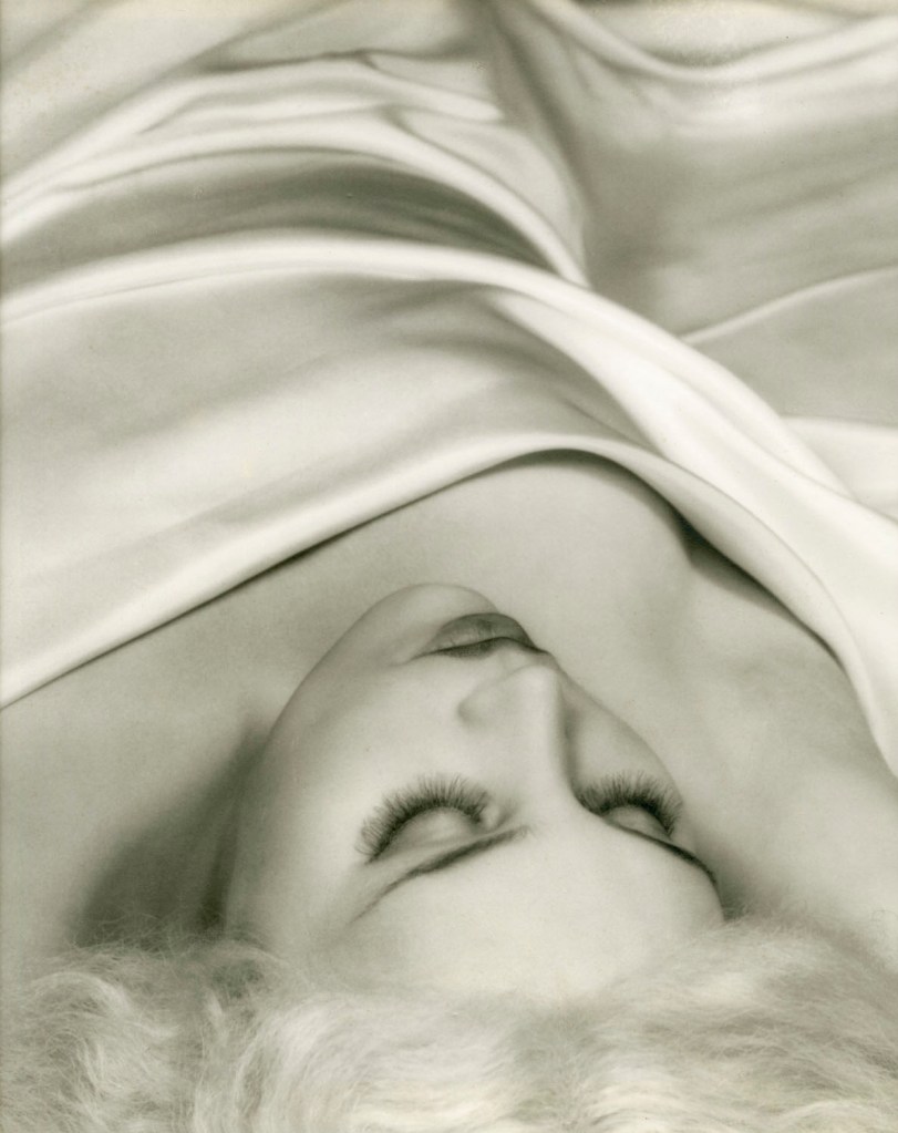 Paul Outerbridge Jr. (American, 1896-1959) 'Woman in Bed (under satin sheets)' c. 1933