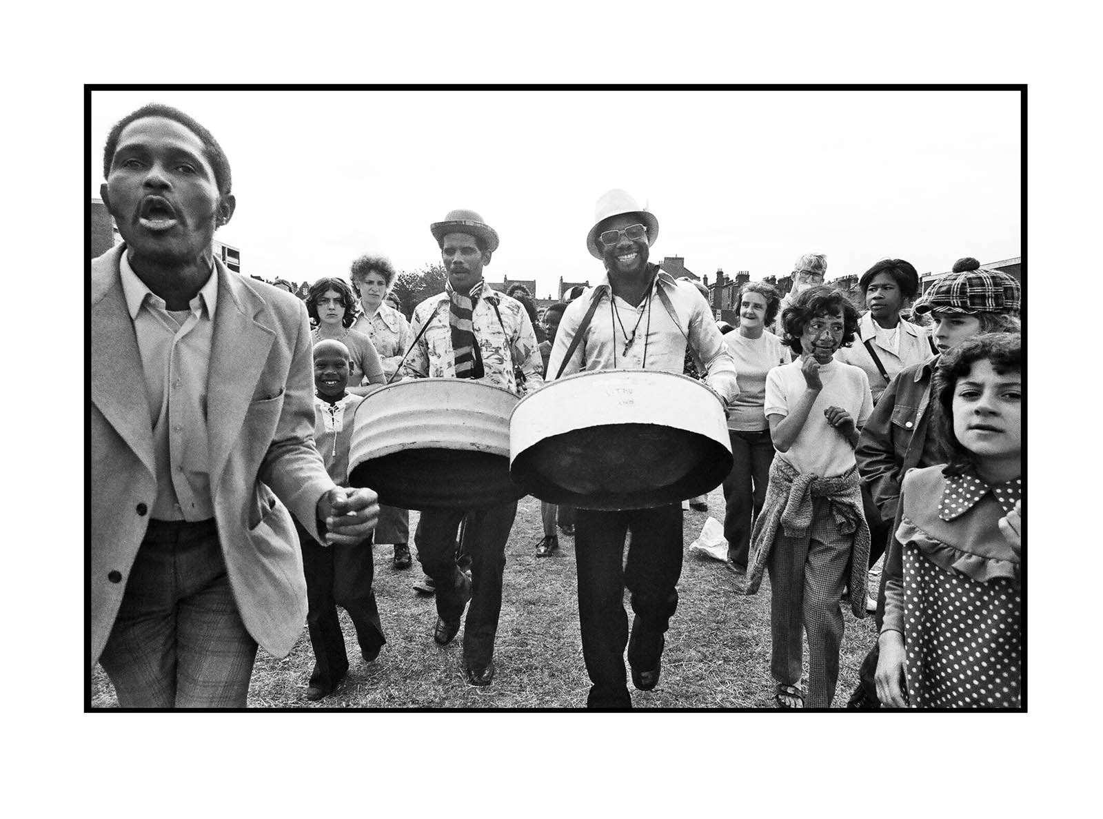 Diane Bush (British born America, b. 1947) 'E1 Festival steel band performers' Early 1970s Diane Bush (British born America, b. 1947) 'E1 Festival steel band performers' Early 1970s