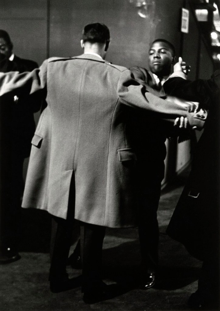 Gordon Parks (American, 1912-2006) 'Newsman Being Frisked at Muslim Rally in Chicago' 1963, printed 1997