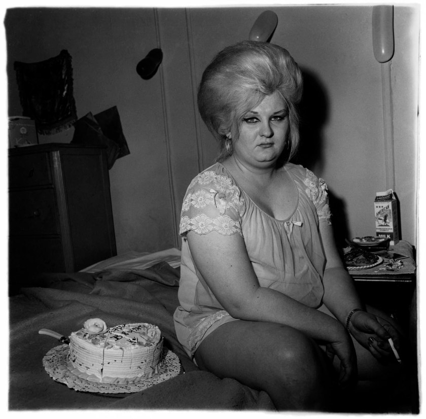 Diane Arbus (American, 1923-1971) 'Transvestite with her birthday cake, N.Y.C. 1969' 1969 from the exhibition 'Diane Arbus: Sanctum Sanctorum' at David Zwirner, London, Nov 2025 - Jan 2026