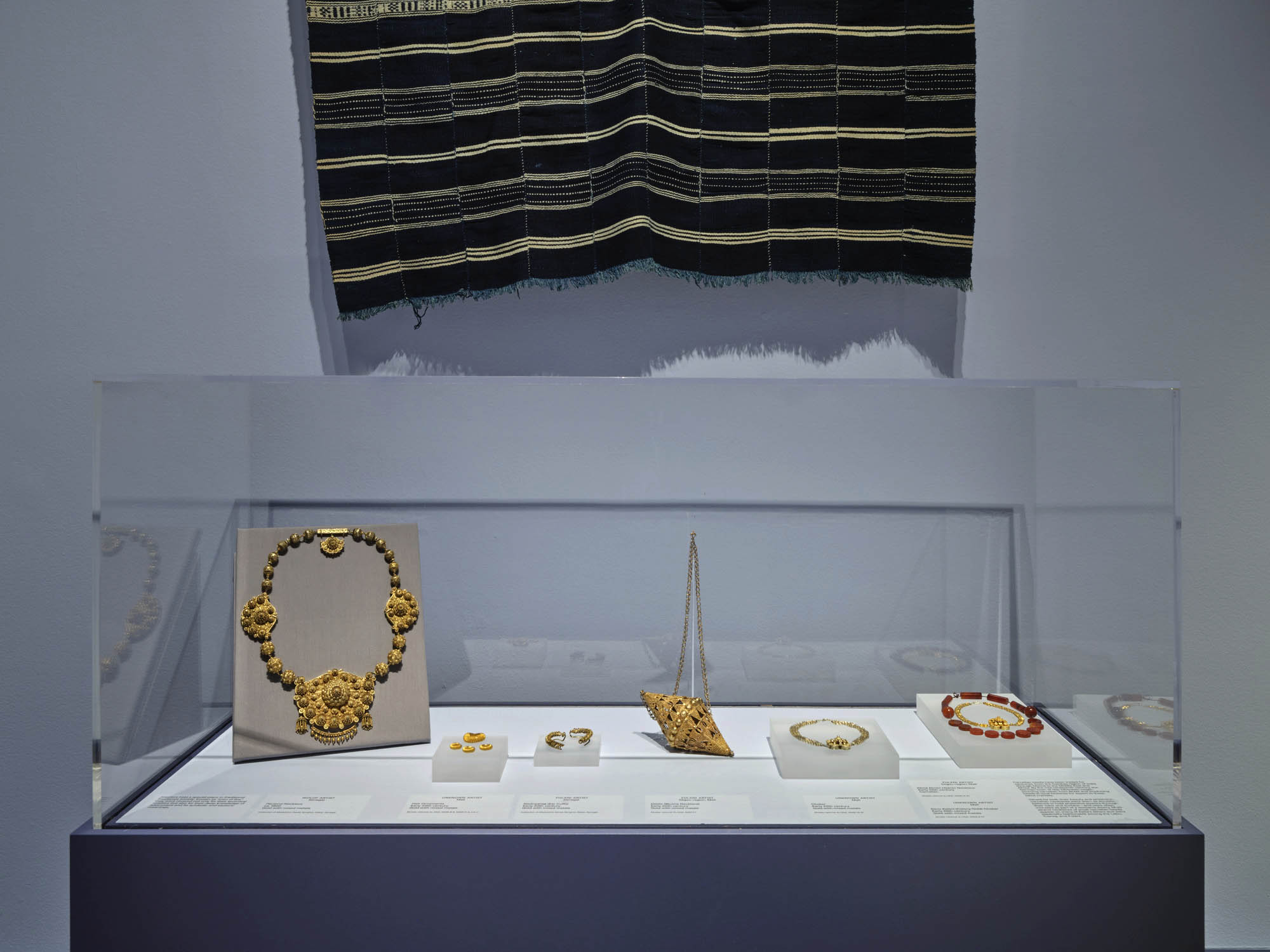 Installation view of the exhibition 'Seydou Keïta: A Tactile Lens' at the Brooklyn Museum, New York, October 2025 - May 2026 showing gold and carnelian jewellery Installation view of the exhibition 'Seydou Keïta: A Tactile Lens' at the Brooklyn Museum, New York, October 2025 - May 2026 showing gold and carnelian jewellery