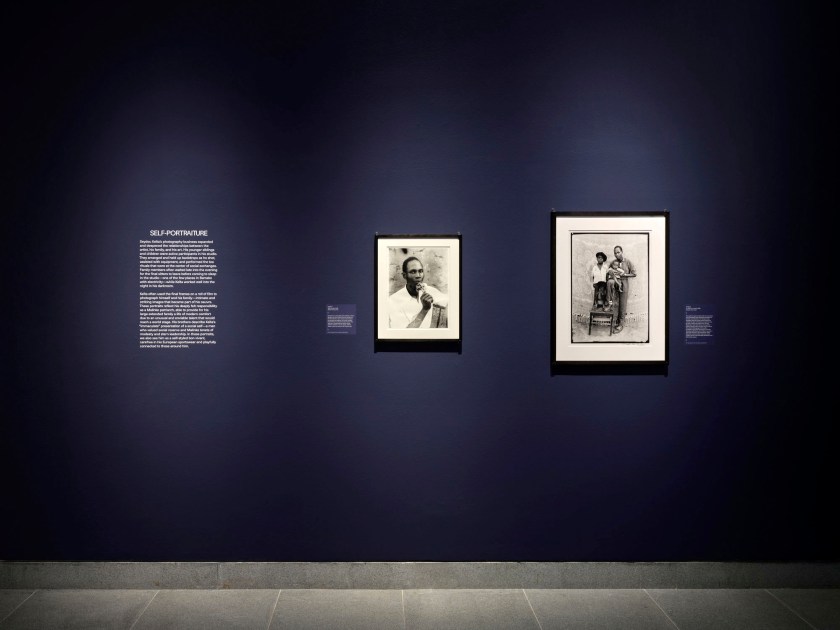 Installation view of the exhibition 'Seydou Keïta: A Tactile Lens' at the Brooklyn Museum, New York, October 2025 - May 2026 showing at left text for the section "Self-portraiture" and then Keïta's 'Untitled' 1956, printed 2018 Installation view of the exhibition 'Seydou Keïta: A Tactile Lens' at the Brooklyn Museum, New York, October 2025 - May 2026 showing at left text for the section "Self-portraiture" and then Keïta's 'Untitled' 1956, printed 2018