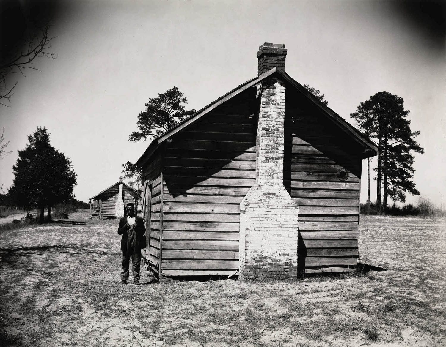 Walker Evans (American, 1903-1975) 'Man Posing for Picture in front of Wooden House' 1936 Walker Evans (American, 1903-1975) 'Man Posing for Picture in front of Wooden House' 1936