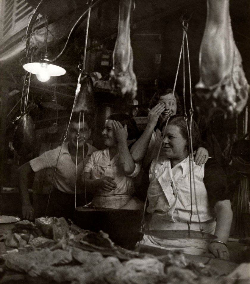 Dora Maar (French 1907-1997) 'Vendors laughing behind their charcuterie stall, Barcelona' (Vendeuses et vendeur riant derrière leur étal de charcuterie, Barcelone) 1933