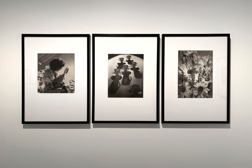 Installation view of the exhibition 'Women Photographers 1900-1975: A Legacy of Light' at NGV International, Melbourne, November 2025 - May 2026 showing from left to right, Olive Cotton's 'Girl with mirror' (1938); 'Teacup ballet' (1935 printed 1992); 'Shasta daisies' (1937 printed 1992)