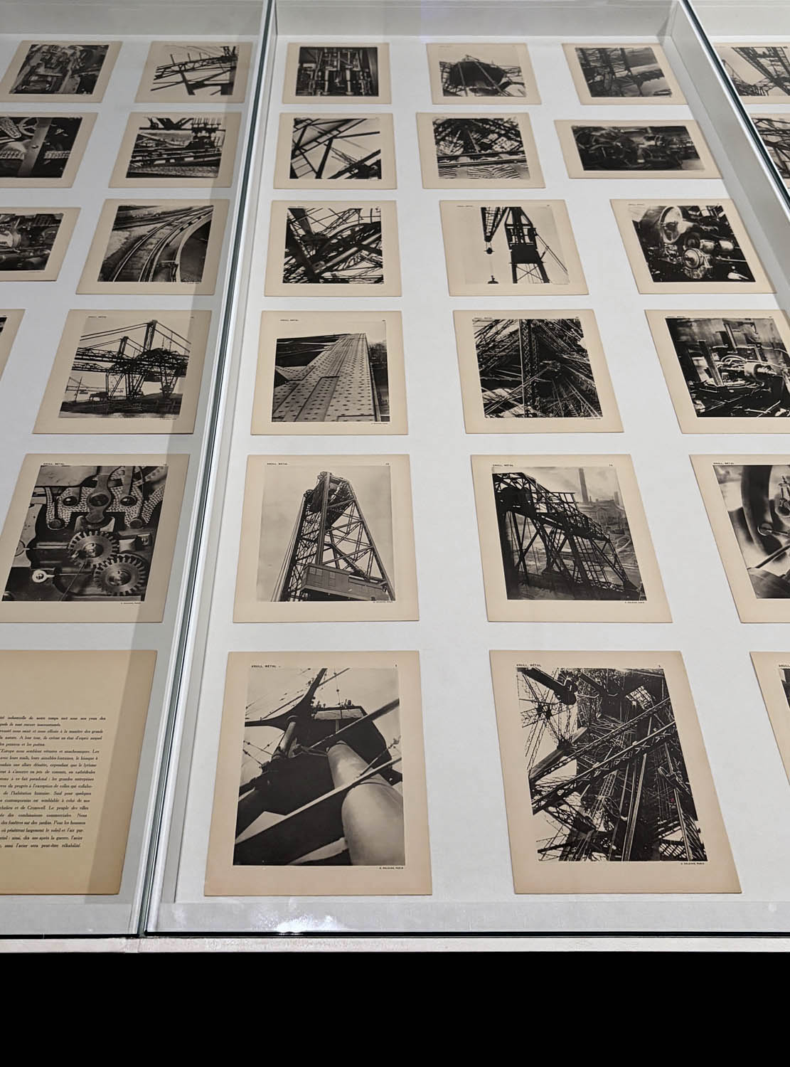 Installation view of the exhibition 'Women Photographers 1900-1975: A Legacy of Light' at NGV International, Melbourne, November 2025 - May 2026 showing in the foreground, Germaine Krull's portfolio 'Métal' 1928