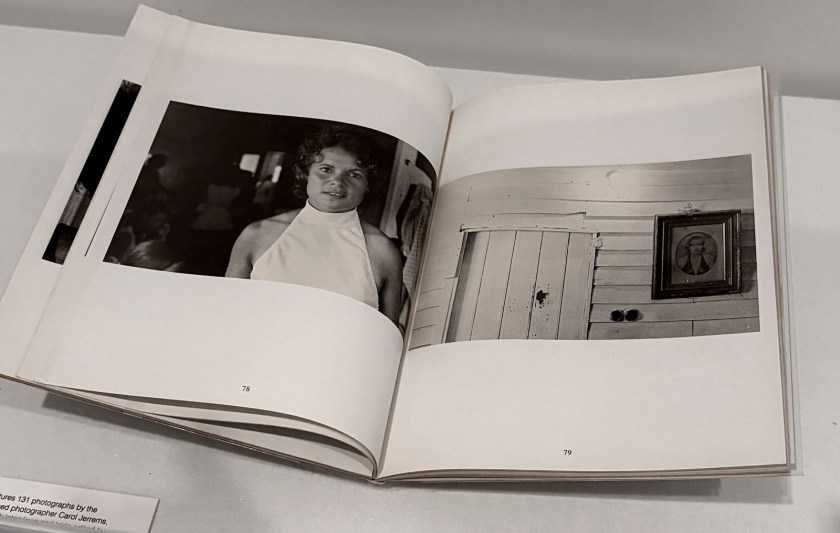 Installation view of the exhibition 'Women Photographers 1900-1975: A Legacy of Light' at NGV International, Melbourne, November 2025 - May 2026 showing pages from Carol Jerrems (Australian, 1949-1980) and Virginia Fraser ​(Australian, 1947-2021) 'A book about Australian Women' ​Melbourne, Outback Press, 1974​ (below)