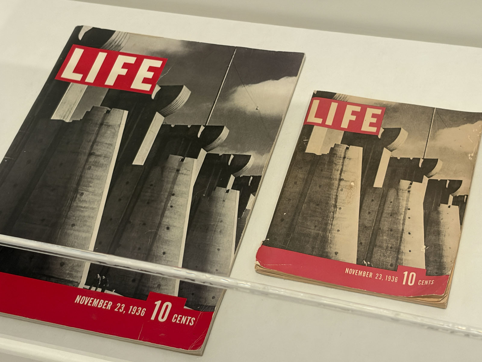 Margaret Bourke-White (American, 1904-1971) 'Fort Peck Dam, Montana' Front cover, 'Life' magazine, first issue, November 1936 (left); Margaret Bourke-White (American, 1904-1971) 'Fort Peck Dam, Montana' Front cover, 'Life' magazine, first issue, November 1936, 'Salesman's edition' (second left) Margaret Bourke-White (American, 1904-1971) 'Fort Peck Dam, Montana' Front cover, 'Life' magazine, first issue, November 1936 (left); Margaret Bourke-White (American, 1904-1971) 'Fort Peck Dam, Montana' Front cover, 'Life' magazine, first issue, November 1936, 'Salesman's edition' (second left)
