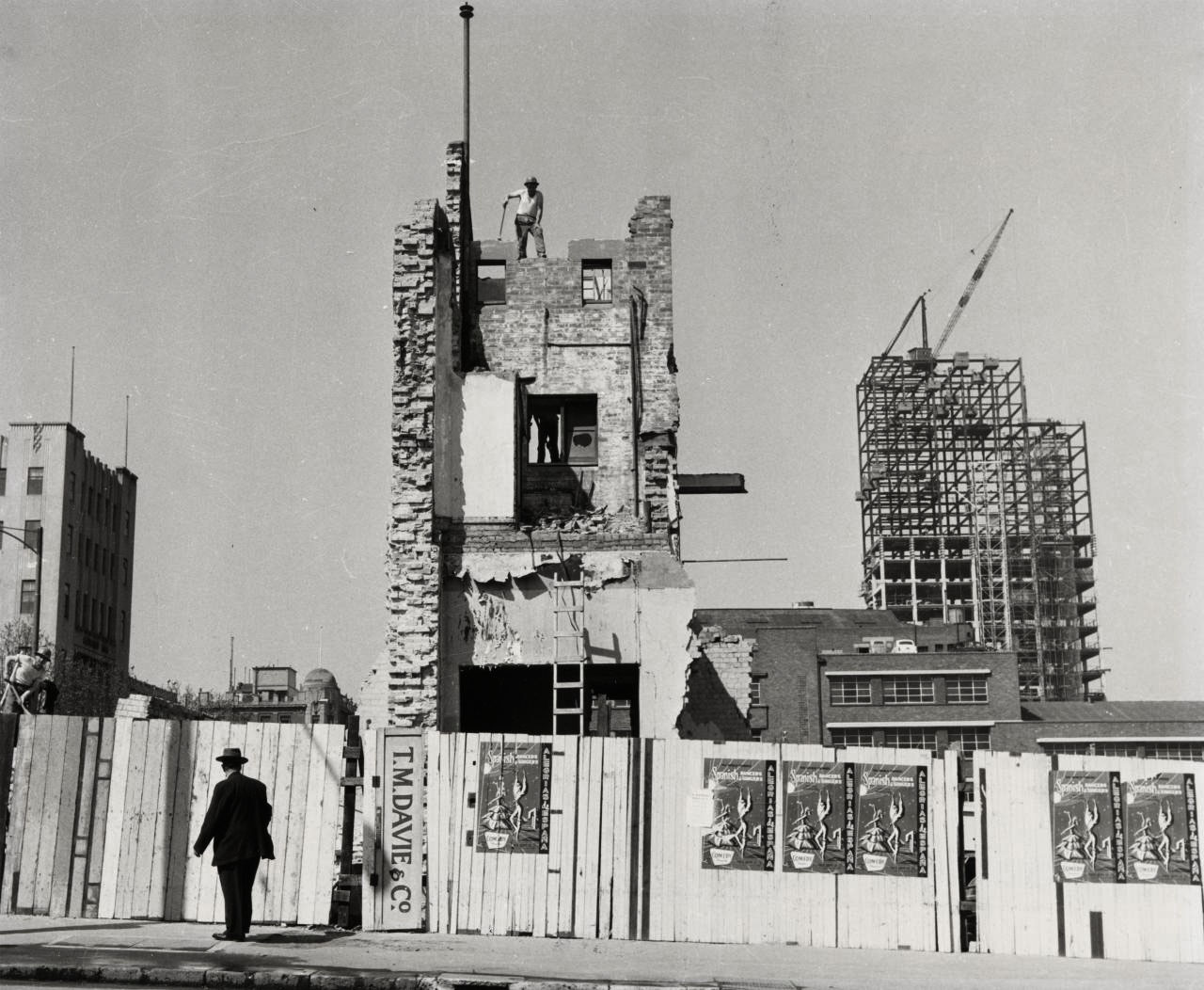 Heather George (Australian, 1907-1983) 'The last wall of Melbourne's Old Eastern Markets comes down for the Southern Cross' c. 1966, printed 1978 Heather George (Australian, 1907-1983) 'The last wall of Melbourne's Old Eastern Markets comes down for the Southern Cross' c. 1966, printed 1978