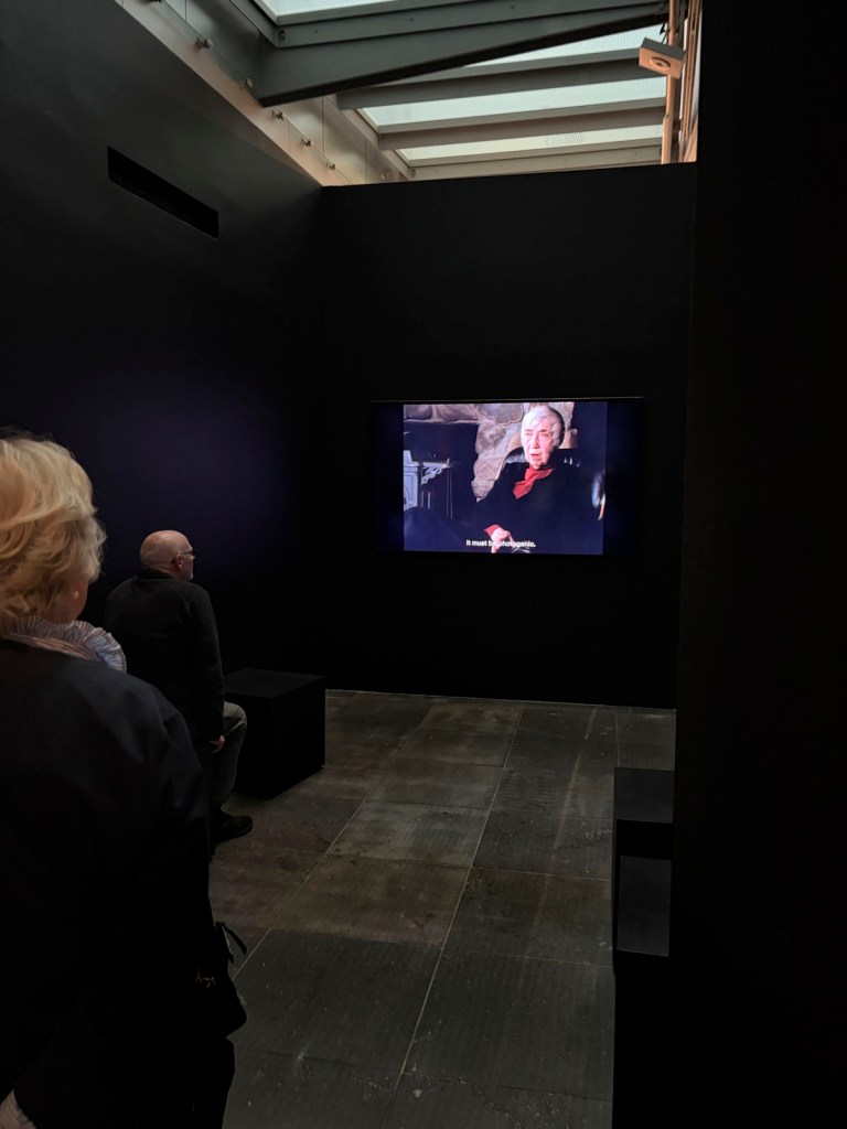 Installation view of the exhibition 'Women Photographers 1900-1975: A Legacy of Light' at NGV International, Melbourne, November 2025 – May 2026 showing a video of Imogen Cunningham
