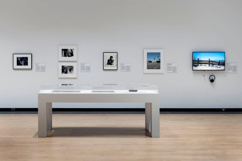Installation view of the exhibition 'Muscle Memory: Lens on the Body' at the Phoenix Art Museum, Phoenix, AZ, January - June, 2026 showing at left, Roy DeCarava Force, New York (1963); at centre, George Dureau Wilbert with Hook (Nd); and at second right, William Camargo As Far As I Can Get in 10 Seconds From The Swapmeet Parking Lot to the Liquor Store After Divola (2020)