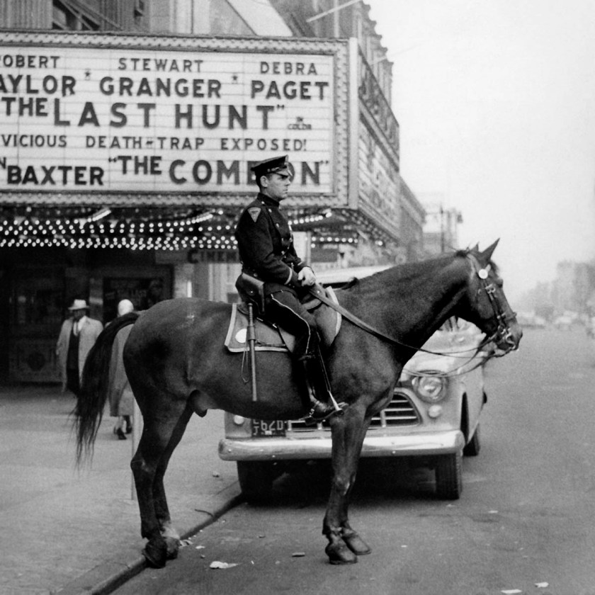 F.C. Gundlach (German, 1926-2021) 'Mounted police officer in front of a cinema in Harlem', New York, 1956