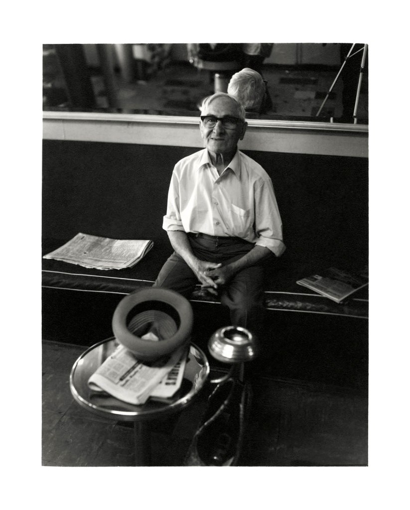 Viva Gibb (Australian, 1945-2017) 'Man at Jack Rozen's barber shop, 9 Errol Street, North Melbourne' c. 1983