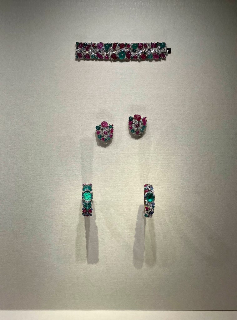Installation view of the exhibition 'Cartier' at NGV International, Melbourne, June - October, 2026 showing Tutti Frutti strap bracelet (Cartier New York, Special order 1928, modified in 1929); Pair of Tutti Frutti clip brooches (Cartier New York, 1929); Tutti Frutti bracelet-watch (Cartier Paris, 1929); Secret watch (Cartier, 2024)