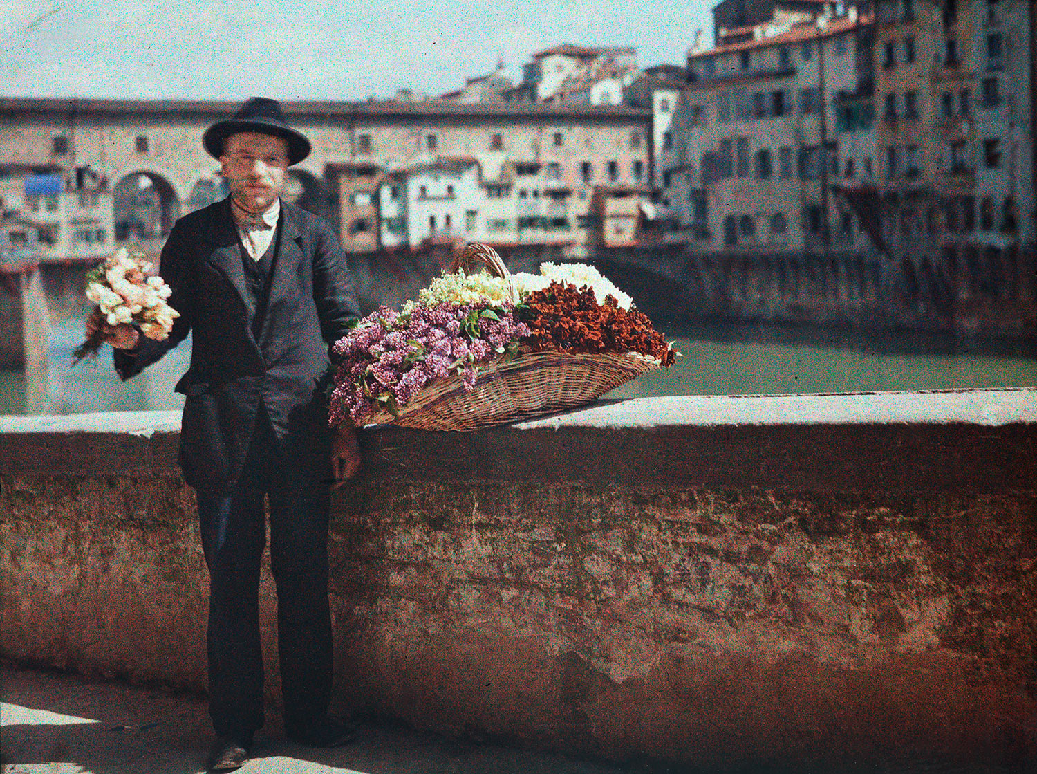 Anonymous photographer. 'Flower Seller in front of the Ponte Vecchio in Florence, Italy' 1907-1930
