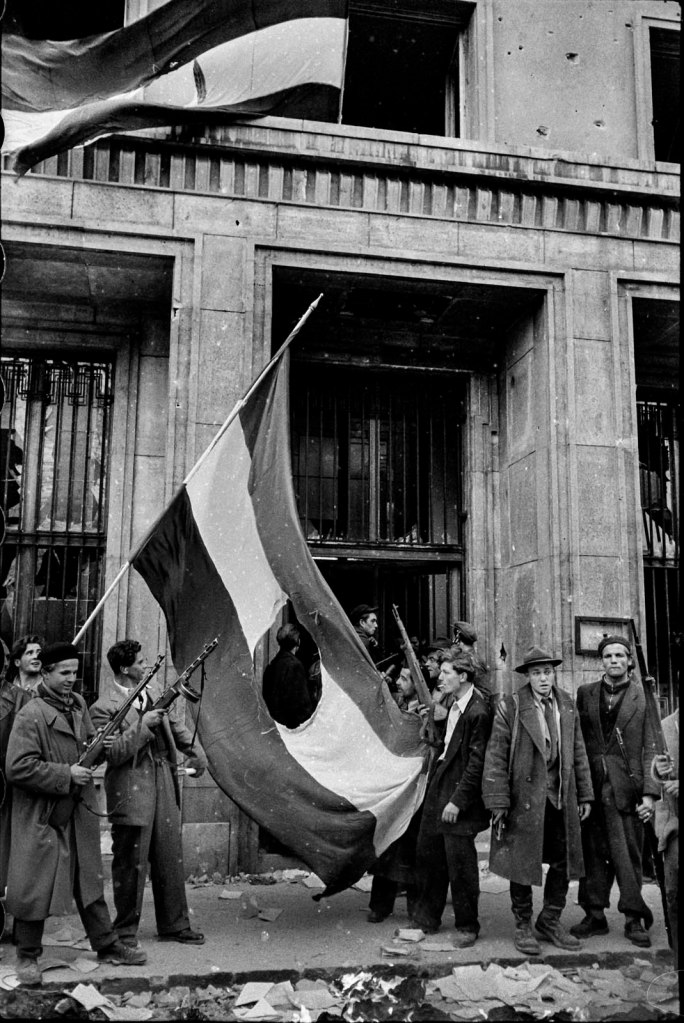 John Sadovy (English born Czech, 1925-2010) 'Insurgents with a ‘flag with a hole’ symbol of the revolution' Hungary October 1956
