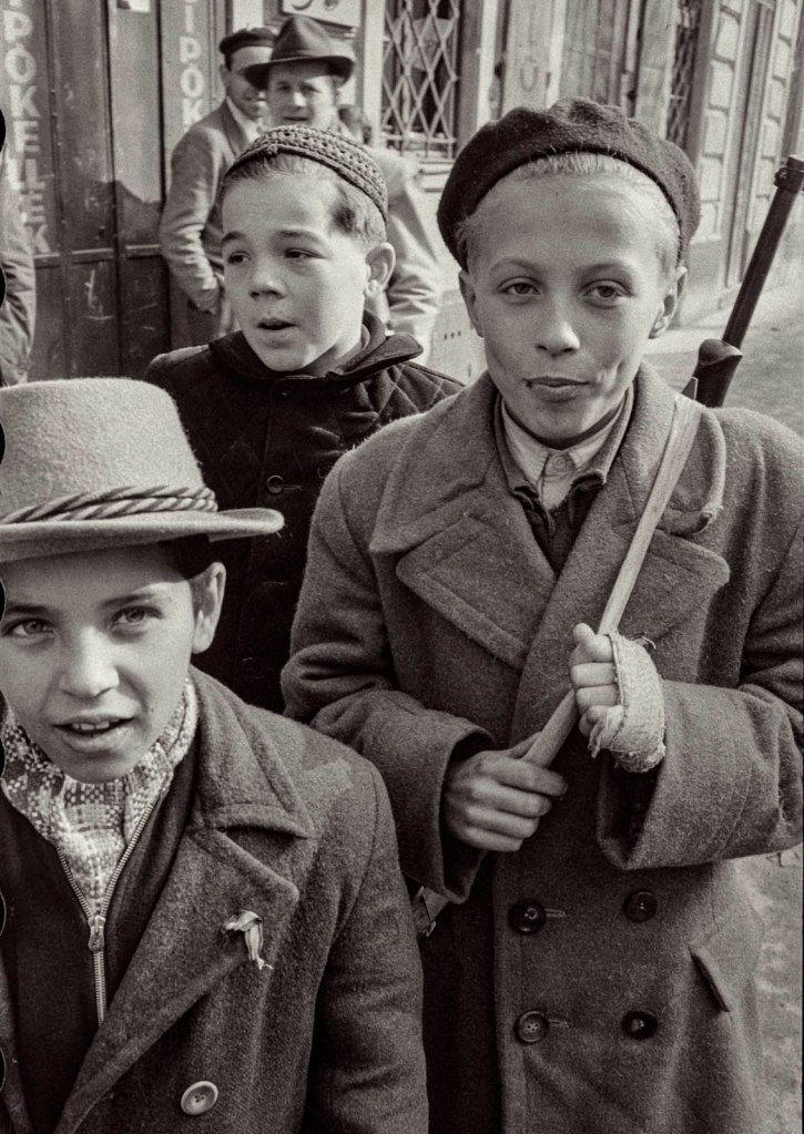John Sadovy (English born Czech, 1925-2010) 'Three young teenagers at the corner of Üllői Avenue and Kisfaludy Street' Hungary October 1956